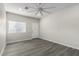 Spacious bedroom with vinyl plank flooring and ceiling fan at 16008 N Hollyhock St, Surprise, AZ 85378