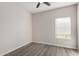 Simple bedroom with wood-look floors and window blinds at 16008 N Hollyhock St, Surprise, AZ 85378