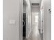 Clean hallway with wood-look floors and laundry area at 16008 N Hollyhock St, Surprise, AZ 85378