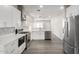 Modern kitchen with white cabinets and stainless steel appliances at 16008 N Hollyhock St, Surprise, AZ 85378