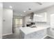 Modern kitchen with white cabinets and marble countertops at 16008 N Hollyhock St, Surprise, AZ 85378