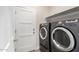 Laundry room with washer, dryer, and shelving at 16008 N Hollyhock St, Surprise, AZ 85378