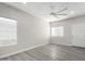 Bright living room with vinyl plank flooring and ceiling fan at 16008 N Hollyhock St, Surprise, AZ 85378