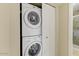 Convenient laundry closet with stackable washer and dryer at 16616 E Palisades Blvd # 206, Fountain Hills, AZ 85268