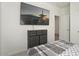 Bedroom featuring a dresser with drawers, a TV, and neutral decor at 16790 W Molly Ln, Surprise, AZ 85387