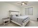 Comfortable main bedroom with a large bed, neutral color scheme, and ample natural light at 16790 W Molly Ln, Surprise, AZ 85387