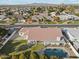 An aerial view highlights this home's large yard, in-ground pool, and a fantastic view of the neighborhood at 1743 E Menlo St, Mesa, AZ 85203