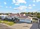 Aerial view of charming single-story home with mature landscaping, long driveway, and lush lawn at 1743 E Menlo St, Mesa, AZ 85203