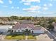 Beautiful aerial view of a single-story home with a tile roof and mature landscaping in a lush community at 1743 E Menlo St, Mesa, AZ 85203