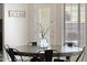 Dining area features a round table with modern black chairs and a decorative centerpiece for stylish dining at 1743 E Menlo St, Mesa, AZ 85203