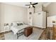 Relaxing main bedroom features neutral colors, ceiling fan, and ensuite bathroom at 1743 E Menlo St, Mesa, AZ 85203