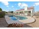 Sparkling pool and patio offer a refreshing retreat with landscaped surroundings at 1743 E Menlo St, Mesa, AZ 85203