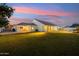 A spacious backyard is great for gatherings and recreation, enhanced by the covered patio and well-maintained lawn at 1743 E Menlo St, Mesa, AZ 85203