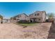 Artificial turf backyard with play area and storage shed at 17774 W Watson Ln, Surprise, AZ 85388