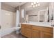 Double vanity bathroom with a tub and shower at 17774 W Watson Ln, Surprise, AZ 85388