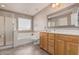 Main bathroom with soaking tub and walk-in shower at 17774 W Watson Ln, Surprise, AZ 85388