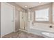 Bathroom featuring a shower and bathtub at 17774 W Watson Ln, Surprise, AZ 85388