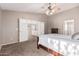 Spacious bedroom with carpet flooring and ceiling fan at 17774 W Watson Ln, Surprise, AZ 85388