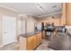 Kitchen with stainless steel appliances and an island at 17774 W Watson Ln, Surprise, AZ 85388