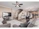 Open living room with a view of kitchen and staircase at 17774 W Watson Ln, Surprise, AZ 85388