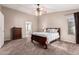 Main bedroom with dresser, ceiling fan, and window coverings at 17774 W Watson Ln, Surprise, AZ 85388