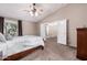 Main bedroom with ensuite bathroom and large window at 17774 W Watson Ln, Surprise, AZ 85388