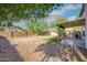 Backyard with covered patio and gravel at 1799 E Erie St, Gilbert, AZ 85295