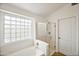 Bathroom with soaking tub and glass shower at 1799 E Erie St, Gilbert, AZ 85295