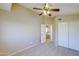 Upstairs bedroom with double doors and ceiling fan at 1799 E Erie St, Gilbert, AZ 85295