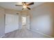 Bedroom with bathroom access and ceiling fan at 1799 E Erie St, Gilbert, AZ 85295