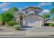 Two-story house with a two-car garage and landscaped front yard at 1799 E Erie St, Gilbert, AZ 85295