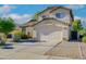 Two-story house with a two-car garage and desert landscaping at 1799 E Erie St, Gilbert, AZ 85295