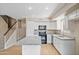 Modern kitchen with island, white cabinets, and granite countertops at 1799 E Erie St, Gilbert, AZ 85295