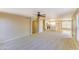 Bright living room with carpet flooring and a ceiling fan at 1799 E Erie St, Gilbert, AZ 85295