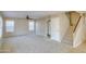 Living room with carpet, ceiling fan, and stairs at 1799 E Erie St, Gilbert, AZ 85295