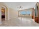 Spacious bedroom with large windows, plantation shutters, and tile floors at 18007 W Ocotillo Ave, Goodyear, AZ 85338