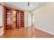 Bedroom with hidden closet and hardwood floors at 18007 W Ocotillo Ave, Goodyear, AZ 85338