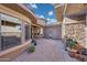 Charming courtyard entry with stone and plants at 18007 W Ocotillo Ave, Goodyear, AZ 85338