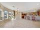 Bright dining room with chandelier and kitchen views at 18007 W Ocotillo Ave, Goodyear, AZ 85338