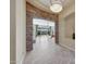 View through entryway showcasing stonework, tile floors, and backyard access at 18007 W Ocotillo Ave, Goodyear, AZ 85338