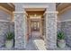 Elegant entryway with stone pillars and gate at 18007 W Ocotillo Ave, Goodyear, AZ 85338