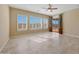 Bright Gathering room with tile floors,sliding doors to backyard, and pool view at 18007 W Ocotillo Ave, Goodyear, AZ 85338