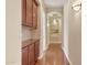 Bright hallway with hardwood floors and built-in cabinetry at 18007 W Ocotillo Ave, Goodyear, AZ 85338