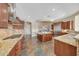 Bright kitchen with granite counters, stainless steel appliances, and tile floors at 18007 W Ocotillo Ave, Goodyear, AZ 85338