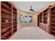 Spacious library with built-in bookshelves and window seat at 18007 W Ocotillo Ave, Goodyear, AZ 85338