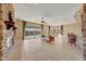 Bright living room with sliding doors to backyard and stone fireplace at 18007 W Ocotillo Ave, Goodyear, AZ 85338