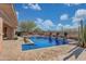 Resort-style pool with water features and spacious patio at 18007 W Ocotillo Ave, Goodyear, AZ 85338