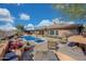 Stunning pool area with ample seating and a built in fire pit at 18007 W Ocotillo Ave, Goodyear, AZ 85338