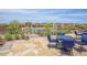 Relaxing patio area with tables and chairs overlooking the pool at 18007 W Ocotillo Ave, Goodyear, AZ 85338