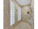 Spa-like shower with glass block walls and built-in bench at 18007 W Ocotillo Ave, Goodyear, AZ 85338